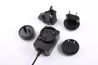 China Stecker-Stromadapter AU-EU US 5V 2A 6V 2A 12V 1A 12W austauschbare BRITISCHE multi Stecker zu verkaufen