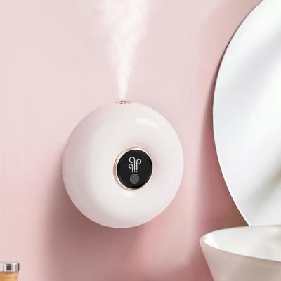 China Outdoor Hotel Car Mall Donut Shape Machine Aroma Diffuser Wall Mounted Aromatherapy Deodorize Automatic Scent Machine Spray Aroma Diffusers for sale