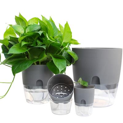 China Modern 50% Discount Factory Wholesale Cheap Garden Round Shape Small Lazy Self Watering Plastic Flower Pot for sale