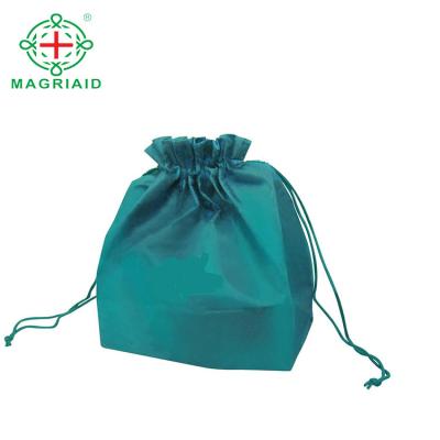 China Waterproof nonwoven bags for shoes fabric textile raw material pp nonwoven fabric embossed flower design grocery bags for sale