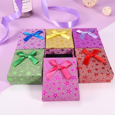 China Paper factory direct sales 7*9*3 can be customized dotsethnic sequin wind and land cover bow cardboard gift box for sale