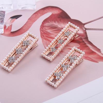 China 2020 New Style Crystal Alligator Bow Tie Flower European and American Korean Letter Bow Creative Pearl Hair Clip for sale