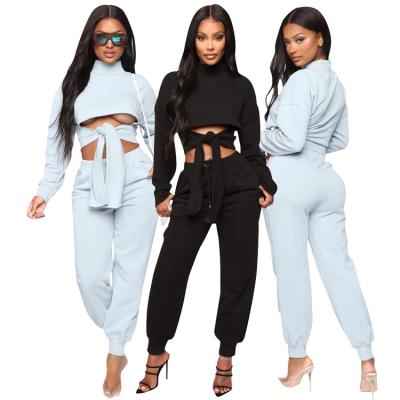 China Anti-pilling new TY20932 fashion cross lacing-up stylish sexy crop tops and sports long pants lady tracksuit two-piece sets for autumn winter for sale