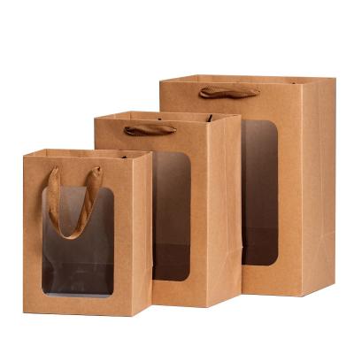 China Recyclable Factory Wholesale Flower Toy Gift Packaging Paper Gift Bags With Clear PVC Window for sale