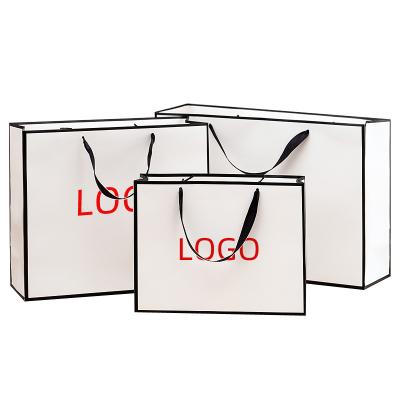 China Boutique Shopping Biodegradable Luxury Paper Bag Printed White Custom Paper Bag With Handle for sale