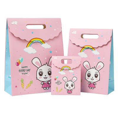 China Recyclable Fashion Custom Logo Shopping Paper Bag With Flap Handle Portable Die Cut Paper Candy Bag for sale