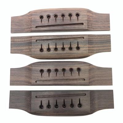 China GUITAR Manufacturer Wholesale Musical Instrument Accessories Rose Wood Material Guitar Bridge for sale