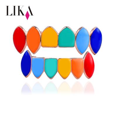 China Custom LIKA hiphop teeth grillz casual/sports shiny decorative jewelry set vampire teeth gold seven color sharp teeth grillz for sale