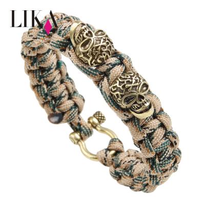 China LIKA Punk Woven Fashionable Vintage Style Pirate Skull Paracord Outdoor Survival Bracelet Metal Clasp Bracelet Charm for sale