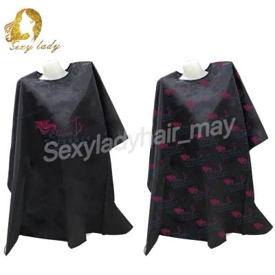 China Salon Custom Logo Printed Salon Capes Barber Cloak Eco Friendly Nonwoven Apron for sale