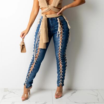 China Color Fade Proof Fall 2021 women clothes fashion sheer denim hollow waist top ripped jeans solid color washed for sale