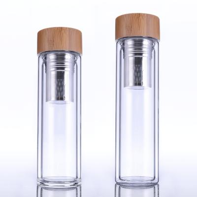 China Double Wall Glass Water Bottle Viable Fruit Infusion Glass Infuser Bottle / Long Glass Tea Infuser Drinking Bottle With Bamboo Lid for sale