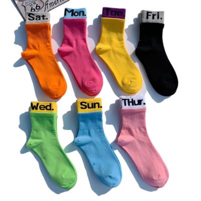 China Breathable Trend Candy Color Online Celebrity Sock All Week Cotton Monday Tuesday Logo Print Fashion Tube Socks Stretch Socks For Women Men for sale