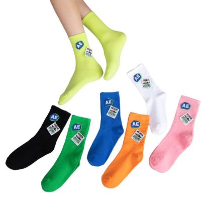 China Breathable Trend Candy Color Online Celebrity Sock All Week Cotton Monday Tuesday Logo Print Fashion Tube Socks Stretch Socks For Women Men for sale