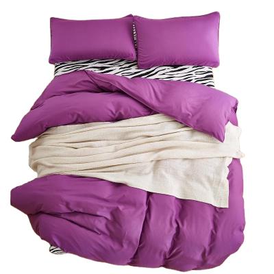 China Cheap Price High Quality Disposable Bedroom Bedding Sheet Set Quilt Cover 90gsm Solid Purple Color for sale