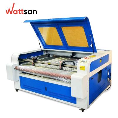 China Wattsan 1610 Duos Conveyor 100W CO2 CNC Laser Water Cooled Machine For Cutting Fabric Leather Fur Silk for sale