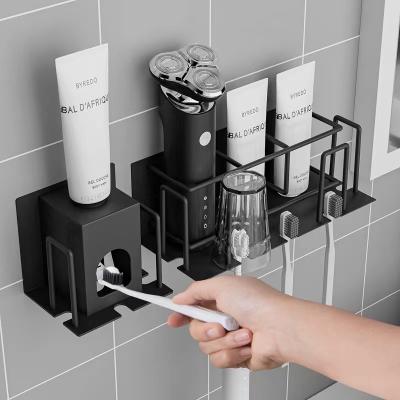 China Wall Mounted Bathroom Stainless Steel Toothbrush Holder Toothpaste Cup Viable Adhesive Storage Holder for sale