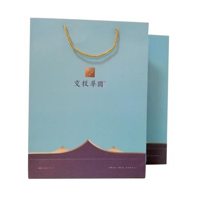 China New Design Kraft Paper Handle Bags Various Popular Durable Patterns With Logo Printing for sale