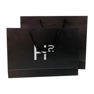 China Recycled Materials Wholesale New Design Logo Full Color Coated Paper Handle Bags For Shopping for sale