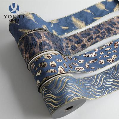 China Viable custom edge wired ribbon polyester fabric luxury gold foil leopard print ribbons for gift wrap for sale