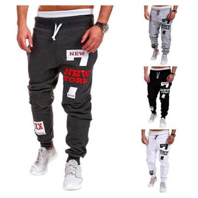 China Anti-wrinkle quality assurance byxor fashion polyester men's gym printing track stretch pants men for sale