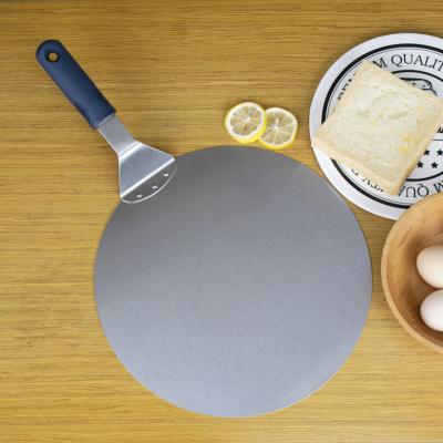 China 12 inch workable round metal pizza peel with wooden handle and pizza cutter wheel and pizza shovel for serving food for sale