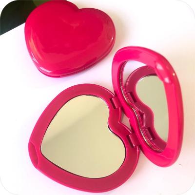 China Gift Promotion Lady Heart Shape Folding Mirror Pocket Magnifying Elegant Small Collectible Mirrors For Purse Perfect For Traveling for sale