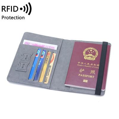 China Mini Hot Sale Cheap Travel Rfid Blocking Wallet Passport Masks Case Passport Wallet Genuine Leather Card Holder for sale