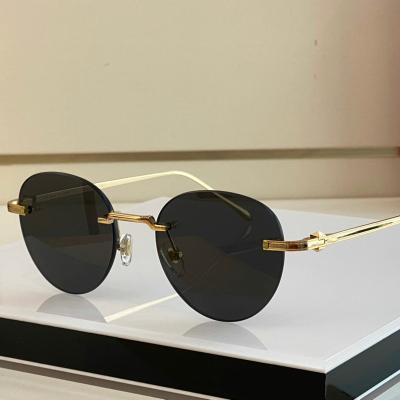 China Fashion Sunglasses 2022 Small Oval Sunglasses New Designer Brand Round Rimless Retro Classic Metal Women Glasses For Men for sale