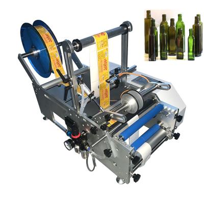 China Beverage labeling machine semi-automatic round bottle lowest price driver automatic bag labeling machine for sale