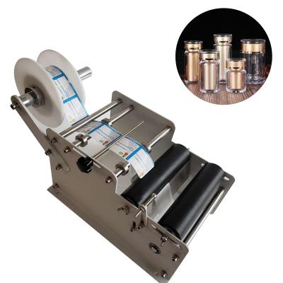 China High Quality Food Sticker Small Bottle Hand Round Bottle Labeling Machine for sale