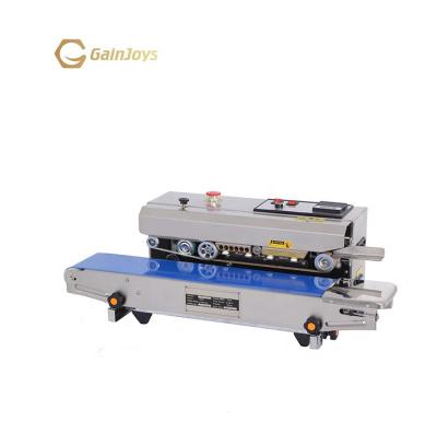 China Food Easy To Operate Small Automatic Horizontal Foil Sealing Machine for sale