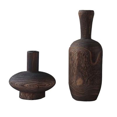 China Traditional black stained wood vase in Paulownia, natural wood flower vase for decor for sale