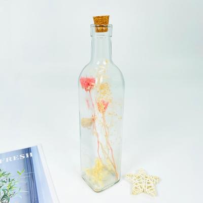 China Modern handmade glass bottle with dry flower inside popular glass home decoration for sale