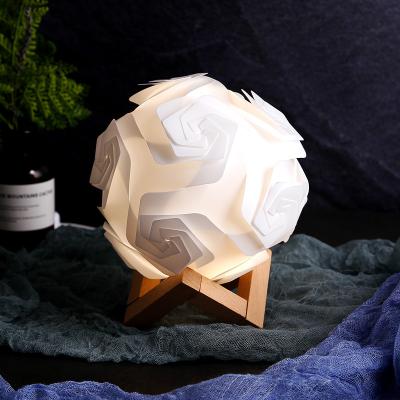 China Modern Creative Wood Base LED Night Light Handwoven Lampshade Rose Shape Bedroom Bedside Night Lamp for sale