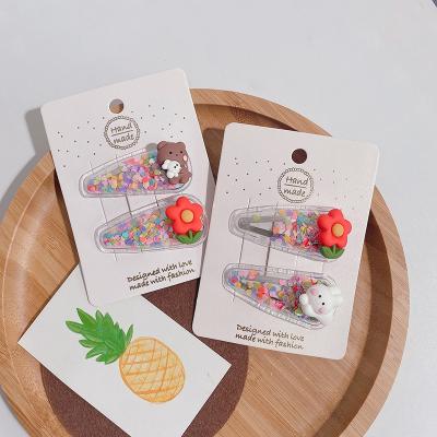 China Hot Selling Geometric Super Cute Sweet Quicksand Transparent Cartoon Resin Kids Hair Clips Sets for sale