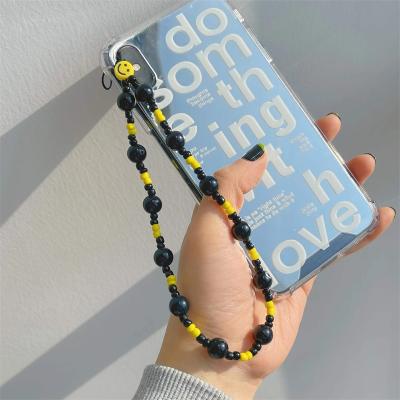 China New Resin Yellow Smiley Hand Beaded DIY Black Beads Anti-lost Mobile Phone Lanyard For Women Cellphone Case Accessories Strap for sale