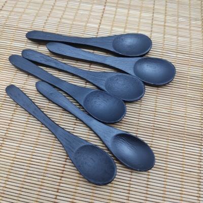 China Viable Custom Wooden 9cm Spoon For Honey Jam Seasoning Black Bamboo Mini Spoon for sale