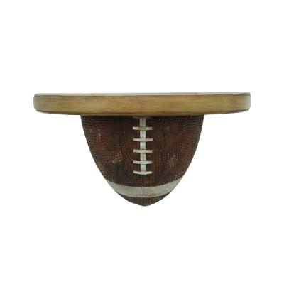 China Decoration resin football shelf hanging statue home decor,basketball shelf hanging,sports symbol shelf wine barrel memorial statue for sale