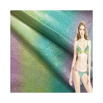 China Gypsophila Stretch Dancing Glitter Fabric Four Way Shiny Wetsuit Cloth Colorful Gold Stretch Fabric For Swimwear for sale