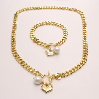 China Hyperbole Statistical Micro Set Zircon Love Cuban Shell Pearl Pendant Thick Chain Copper Cuban Gold Plated Necklace Bracelet Set for sale