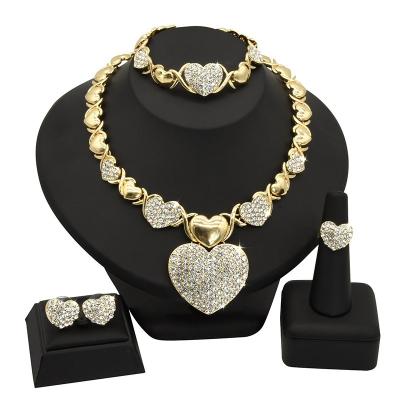 China CLASSIC Hot Selling Dubai Sand Gold Bridal Necklace Set Alloy Love Necklace Bracelet Earring Ring Four Piece Women Wedding Jewelry Set for sale