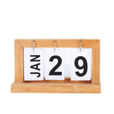 China Beautiful And Practical Modern Simple Creative Living Room Table Arrangement Turn Page Top Fashion Perpetual Wooden Desk Calendar for sale