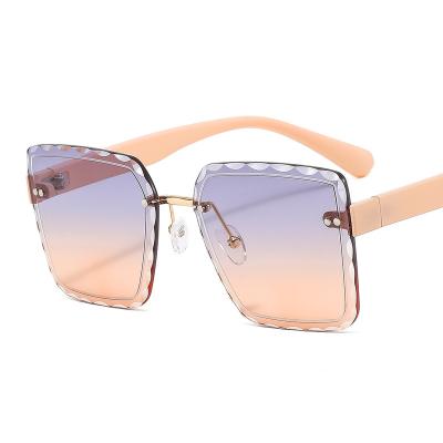 China 2022 fashion sunglasses Sunglass women luxury shades raw shape rimless sunglasses for sale