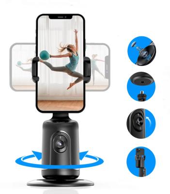 China Adjustable Auto Face Tracking Tripod 360 Rotation Tracking Phone Holder No App Required Rechargeable Battery AI Smart Phone Holder for sale