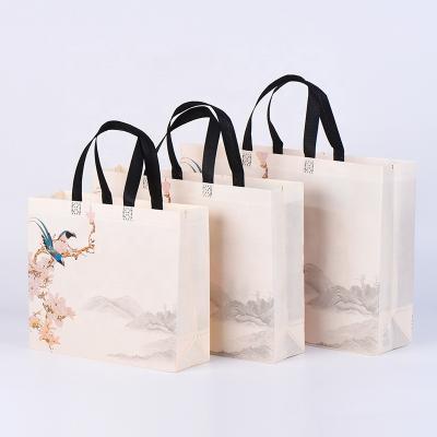 China Wholesale promotional fashion reusable tote ecobag luxury laminated handle pp non woven fabric luxury laminated shopping bag for sale