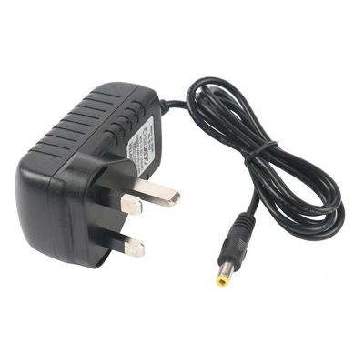 Chine Adaptateur BRITANNIQUE d'approvisionnement d'alimentation CC À C.A. de la prise 1a 12w à C.A. 12v D'adaptateur universel d'alimentation CC à vendre