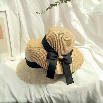 China Korean Women's Bow Ribbon Character Summer Fashion Straw Hat Beach Holiday Sun Block Folding Beach Hat for sale