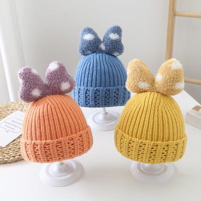 China Hot Sale Autumn And Winter Thick Warm Character Knitted Baby Hats Korean Cute Bowknot Girls Head Hat for sale