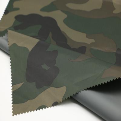 China 100% Memory Polyester Camouflage Print Taffeta 190t PVC Coated Waterproof Raincoat Fabric for sale